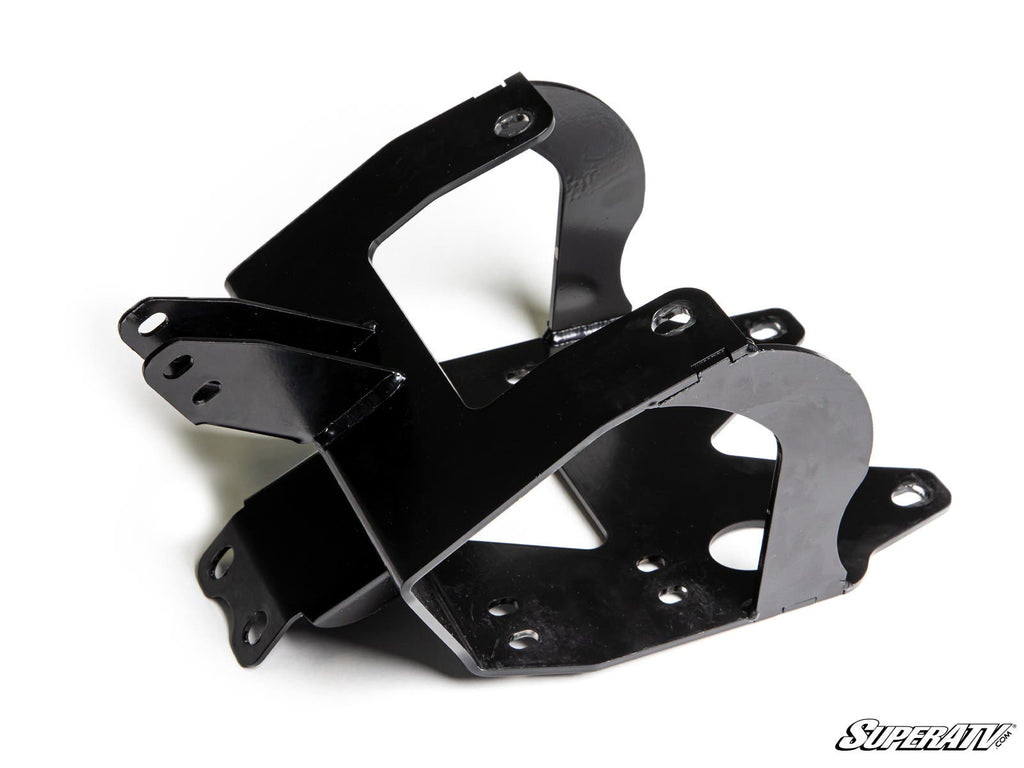 A black metal Can-Am Renegade Winch Mounting Plate with multiple holes and angled, bent surfaces is crossed on a white background. The SuperATV logo is at the bottom right. Designed for off-road vehicle suspension systems.