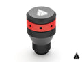 A black and red Assault Industries Stealth Shift Knob for Can-Am Maverick X3 sits on a white background. The tapered knob features a white geometric logo on top, circular holes in the red section, and a small triangular logo at the bottom right.