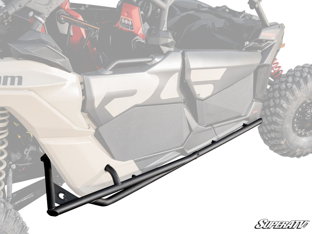 Can-Am Maverick X3 MAX Tree Kickers are shown mounted below the door of a beige off-road vehicle with rugged tires and visible suspension. The background fades to highlight the tree kickers, with the SuperATV logo in the corner.