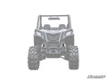 A monochrome front view of a rugged Can-Am Maverick Trail UTV with large knobby tires, roll cage, and two seats. The image is partially faded and features the SuperATV logo in the lower right corner. Product shown: 3 Lift Kit.