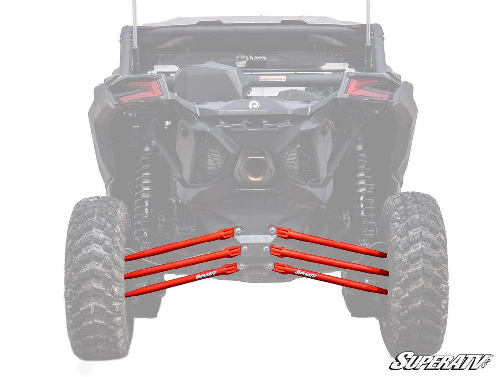 A rear view of a black off-road vehicle showcases its suspension and large tires, with four bright red Can-Am Maverick X3 Tubed Radius Arms prominently displayed in front of the rear wheels. The faded background highlights these upgraded suspension parts.