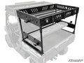 The CFMOTO UForce 1000 Outfitter Bed Rack is a black, heavy-duty metal rack with two tiers, slotted panels, tie-down points, and reinforced edges—mounted on the bed of a utility vehicle shown in partial transparency.