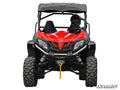 A person in full protective gear and helmet sits at the wheel of a red off-road vehicle with rugged tires, front winch, and black roof. The CFMOTO ZForce 800EX 2 Lift Kit is featured. SuperATV logo appears at the bottom right on a white background.
