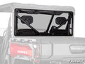 A rear view of a gray UTV features the CFMOTO UForce U10 Pro Rear Windshield—a clear, full-size panel with a black metal frame and support bars, fully covering the rear window area. The SuperATV logo is in the bottom right corner.