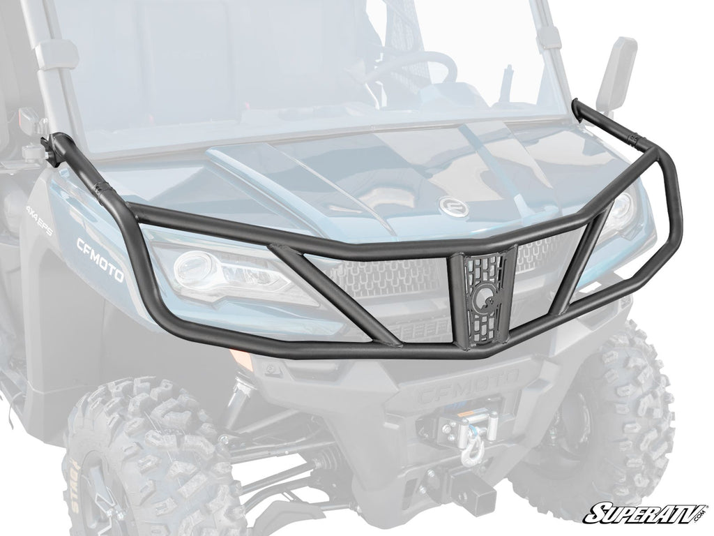 The CFMOTO UForce 1000 Front Bumper, featuring a black heavy-duty tubular design with angular bars and mesh accents, is shown floating in front of a blue off-road utility vehicle’s grill, tires, and winch.
