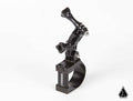 The Assault Industries Rugged Action Camera Mount Clamp is a black metal mount with adjustable knob-secured joints, GoPro-style top connector, SESSION branding, and a small black triangle logo in the white background corner. Designed for handlebars or tub