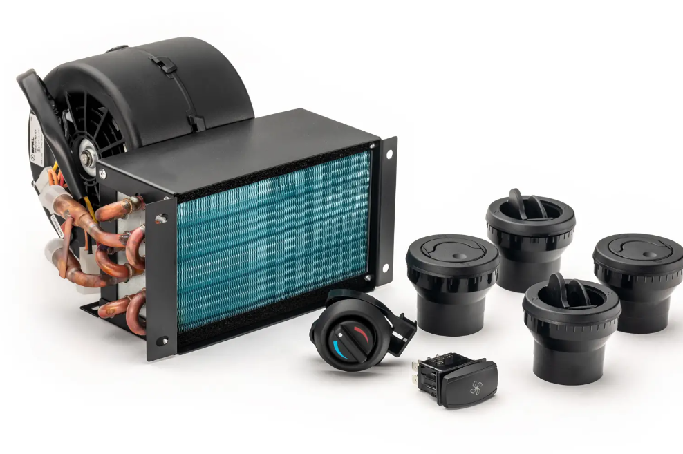 The Can-Am Commander In-Dash Cab Heater, featuring copper coils, a fan, four round air vents, and two black control switches (one with blue and red temperature markings), is shown on a white background.