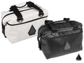 Two Assault Industries RUXAK Rugged Offroad Cooler Bags—one white, one black—each with black zippers, handles, side buckles, and a triangular geometric logo on the front. Both bags are rectangular and set against a white background.