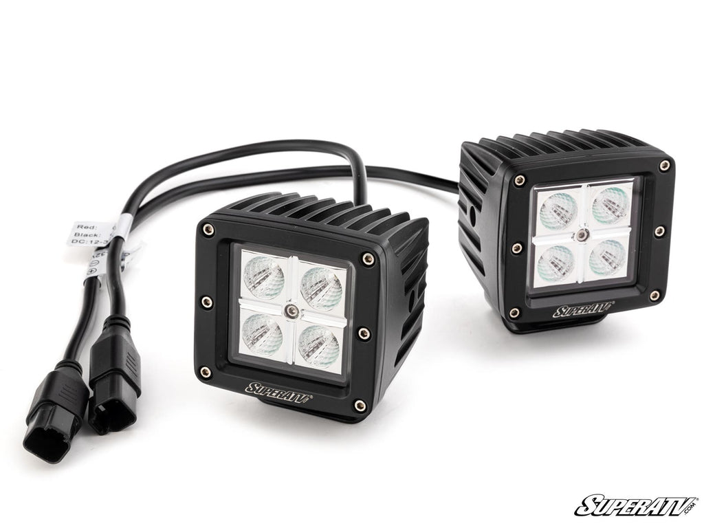 Two black, square Polaris Ranger Rear-Facing LED Cube Lights feature ridged housing and four LEDs each, connected by black cords with dual plug connectors. The SuperATV brand is printed on the lights; background is plain white.