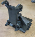 The Defender Limited & Cab Tablet/Phone Holder Center Insert, in black, features an adjustable angular base, two padded clamps for securing devices, and a design with sharp edges and screws for easy adjustment—perfect for any light wooden surface.