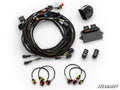 Polaris RZR XP 1000 Deluxe Self-Canceling Turn Signal Kit shown on a white background: includes black wiring harness, connectors, four orange-back sensors, SuperATV-labeled control module, two switches, and horn. SuperATV logo in the corner.