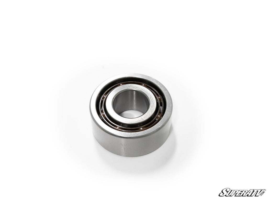 A close-up of a single round bearing from the Polaris ACE Front Differential Bearing and Seal Kit, highlighting its smooth inner and outer rings on a white background with the SuperATV logo in the bottom right corner.