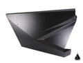 The Assault Industries Stinger Doors for Polaris RZR Pro XP and Pro R feature a geometric, angular black metal design with sharp edges and flat surfaces, forming an abstract 3D shape against a white background. A small black triangle icon is at the lower 