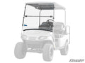 A Corsa Blue E-Z-GO TXT Valor Flip Down Windshield is shown installed on a white EZGO golf cart, highlighted in color while the rest of the cart is faded. The SuperATV logo appears in the bottom right corner.