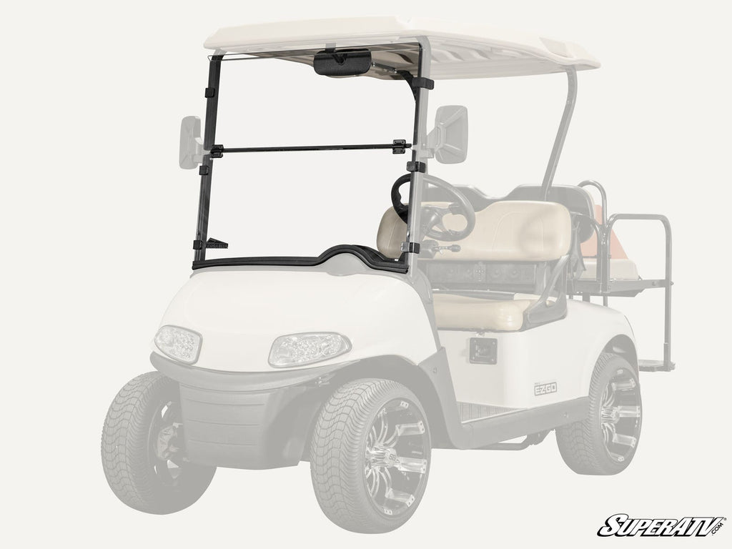 A Corsa Blue E-Z-GO RXV golf cart with black trim and chrome wheels, shown with a clear, two-piece flip down windshield; the “SuperATV” logo is visible in the bottom right corner.