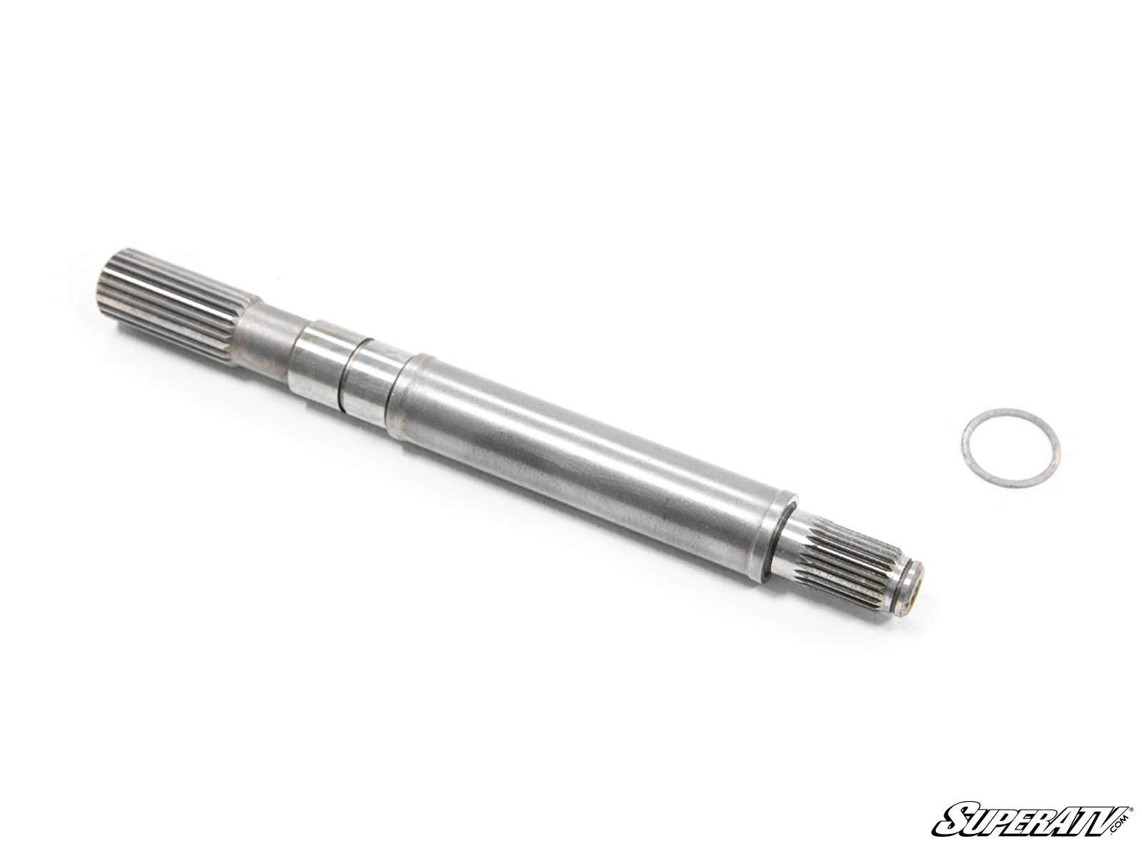 A Polaris Front Output Shaft with splined ends is shown on a white background, accompanied by a small metal ring near one end. The SuperATV logo appears in the bottom right corner.
