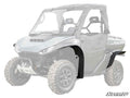 A gray side-by-side UTV features Segway Fugleman UT10 Low Profile Fender Flares in black on the front and rear wheel wells, large off-road tires, windshield, hard top, and two seats. SuperATV logo appears in the bottom right corner.