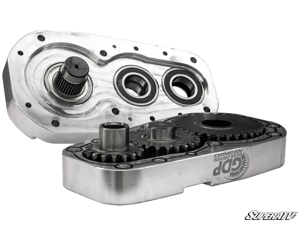 An open gear case for the Polaris RZR Trail 900 8 Portal Gear Lift displays interlocked gears and shafts inside a rectangular housing with machined edges, circular openings, and the “GDP Gear Driven Performance” logo with SuperATV branding.