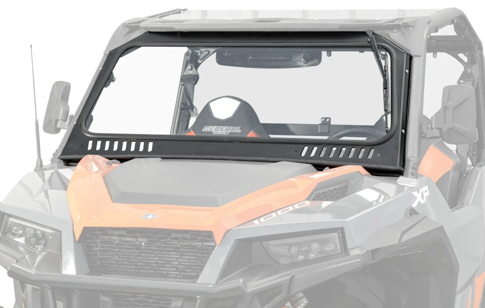 A close-up of a Polaris General Glass Windshield installed on an orange and gray off-road utility vehicle, featuring vented openings along the bottom and a tinted, angular design with bold lines and a partially visible seat inside.