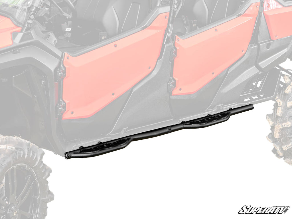 A set of Honda Pioneer 1000-6 Heavy-Duty Nerf Bars in black steel is shown beneath the red doors of an off-road side-by-side, on a white background. The SuperATV logo appears in the lower right. These bars protect your vehicle’s sides from obstacles.