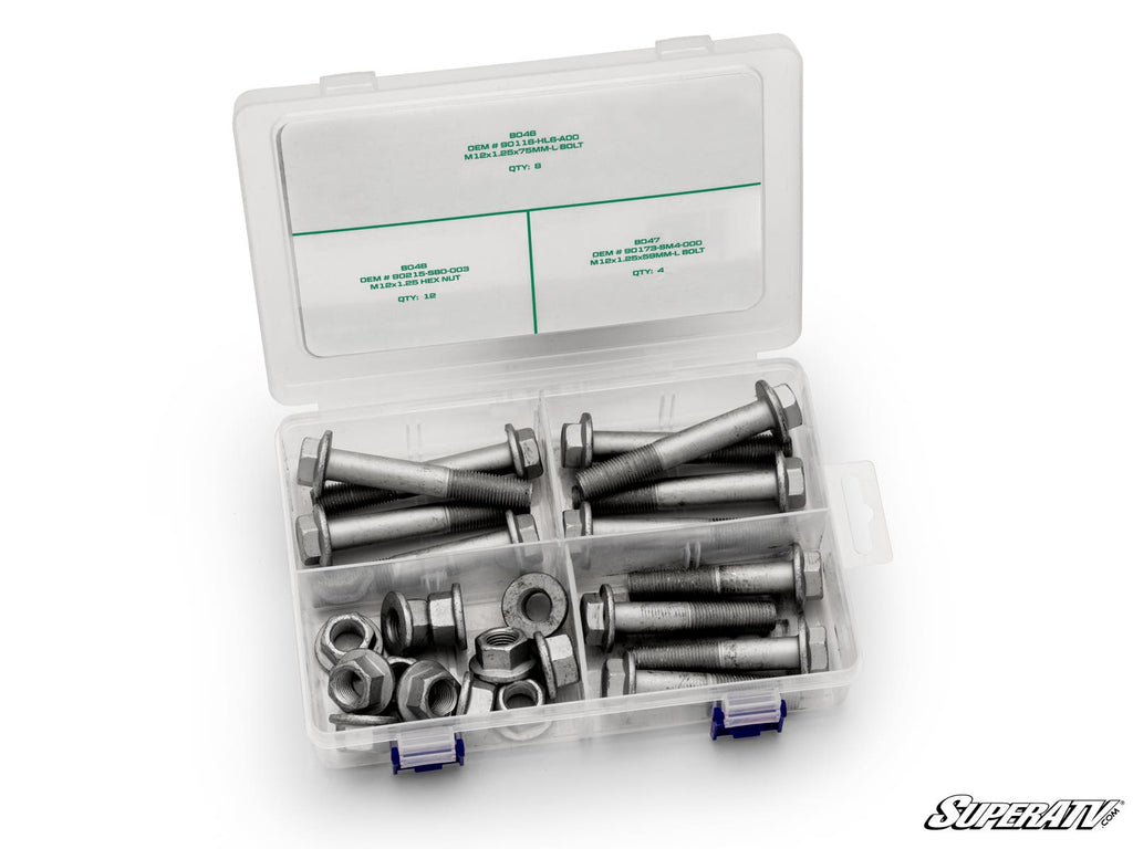 The Up & Running Can-Am Defender Suspension Bolt Kit comes in a clear plastic container with four labeled compartments for different bolts and nuts. The white lid features blue clasps, and the SuperATV logo appears at the bottom right.