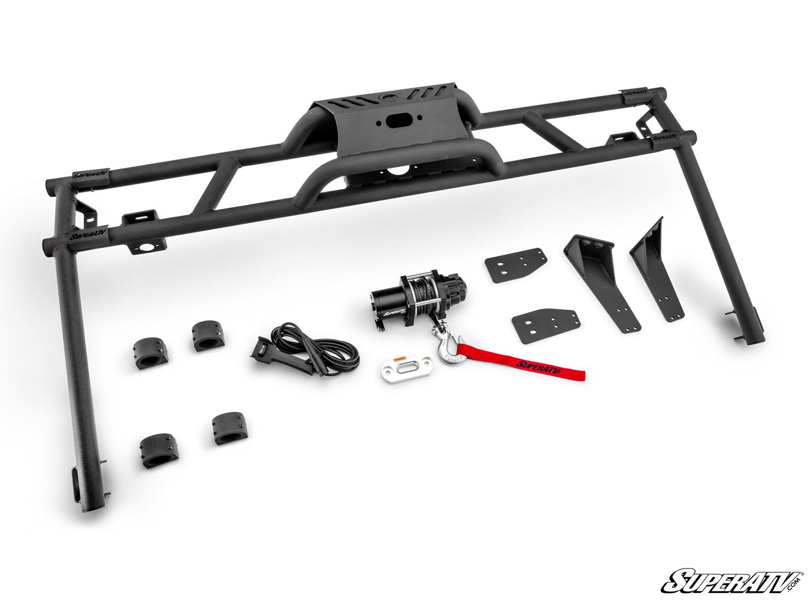 A black metal Honda Pioneer 700 Game Loader Rack kit is shown on a white background, including a large bumper frame, winch with cable and remote, metal brackets, clamps, mounting hardware, and a red SuperATV strap. SuperATV logo in bottom right.