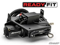A Honda Talon 1000 Ready-Fit Winch kit with a black metal housing, cables, and hook is displayed on a white background. The SuperATV and READY FIT logos are visible. Electrical wires are neatly arranged in its rugged design.