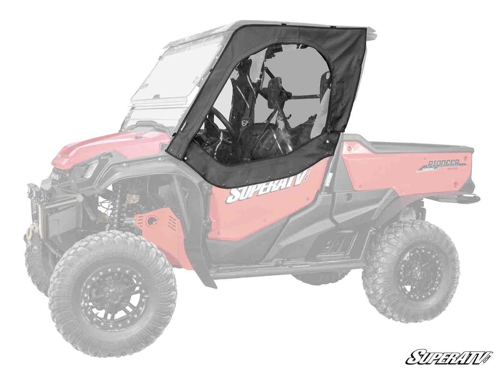A black Honda Pioneer 1000 Primal Soft Cab Enclosure Upper Door with a clear window is installed on the drivers side of a red SuperATV utility vehicle, while the rest of the vehicle is faded to highlight the doors design and placement.