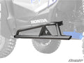 A matte black Honda Talon 1000X Tree Kicker is installed on the side of an off-road vehicle with rugged tires; the semi-transparent body highlights the kicker. “Honda” appears on the side, and “SuperATV” is shown in the bottom right corner.