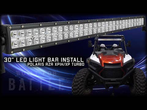 A 30 LED Combination Spot / Flood Light Bar is shown above a red and black Polaris RZR XP/XP Turbo on a dark, swirling blue background. Text: “30” LED LIGHT BAR INSTALL POLARIS RZR XP/XP TURBO”.