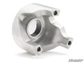 The Can-Am Defender HD10 Rev1 Clutch Kit is a machined metal part with a curved, asymmetrical design, a large central hole, three smaller threaded holes on the edges, and a smooth metallic finish. The SuperATV logo is at the bottom right.