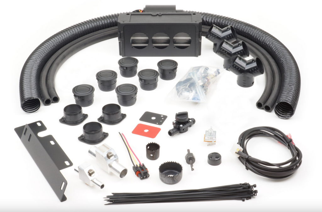 The Polaris Ranger XP1000/1000/Crew (2018-2024) - Ice Crusher Cab Heater kit is shown on a white surface with black ducts, vents, hose clamps, wiring, switches, metal brackets, fasteners, zip ties, grommets, connectors and an air distribution unit.