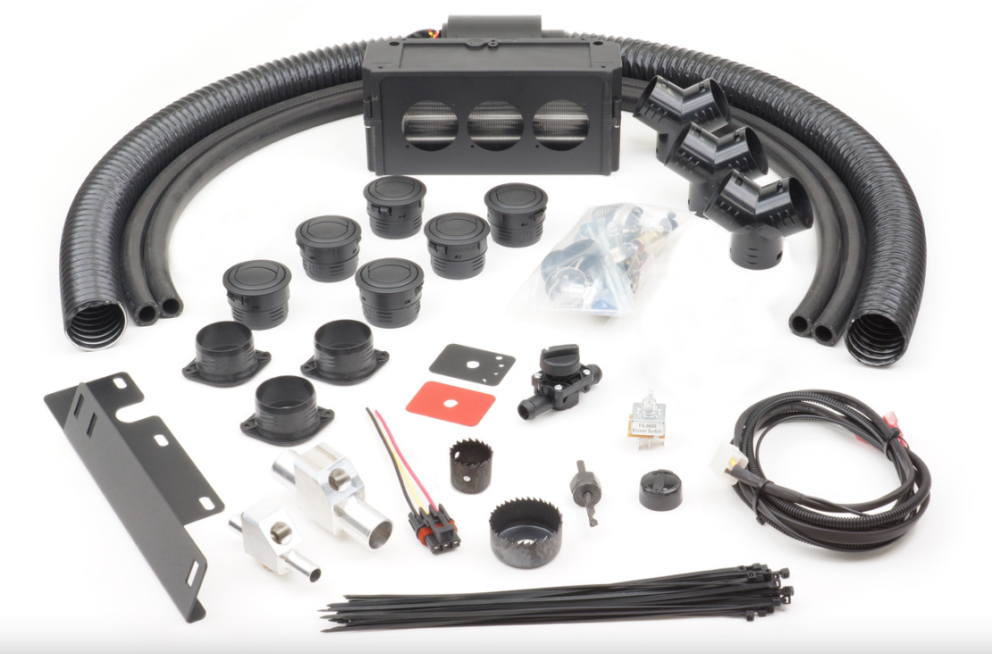 The Polaris Ranger XP1000/1000/Crew (2018-2024) - Ice Crusher Cab Heater kit is shown on a white surface with black ducts, vents, hose clamps, wiring, switches, metal brackets, fasteners, zip ties, grommets, connectors and an air distribution unit.