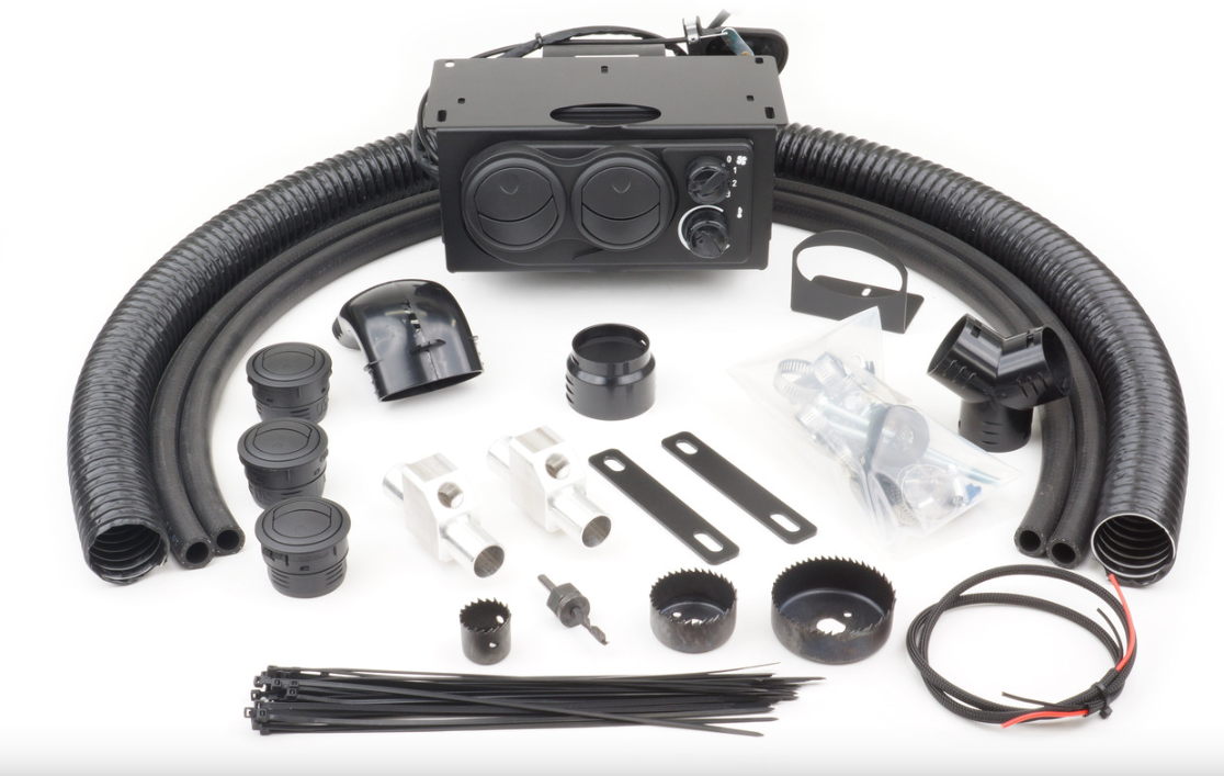 The Yamaha Viking (2014-2021) Ice Crusher Heater kit, shown on a white background, includes a heater unit, black hoses, metal brackets, vents, connectors, wiring, hose clamps, zip ties, plastic mounts, and hole saws—all parts neatly arranged.