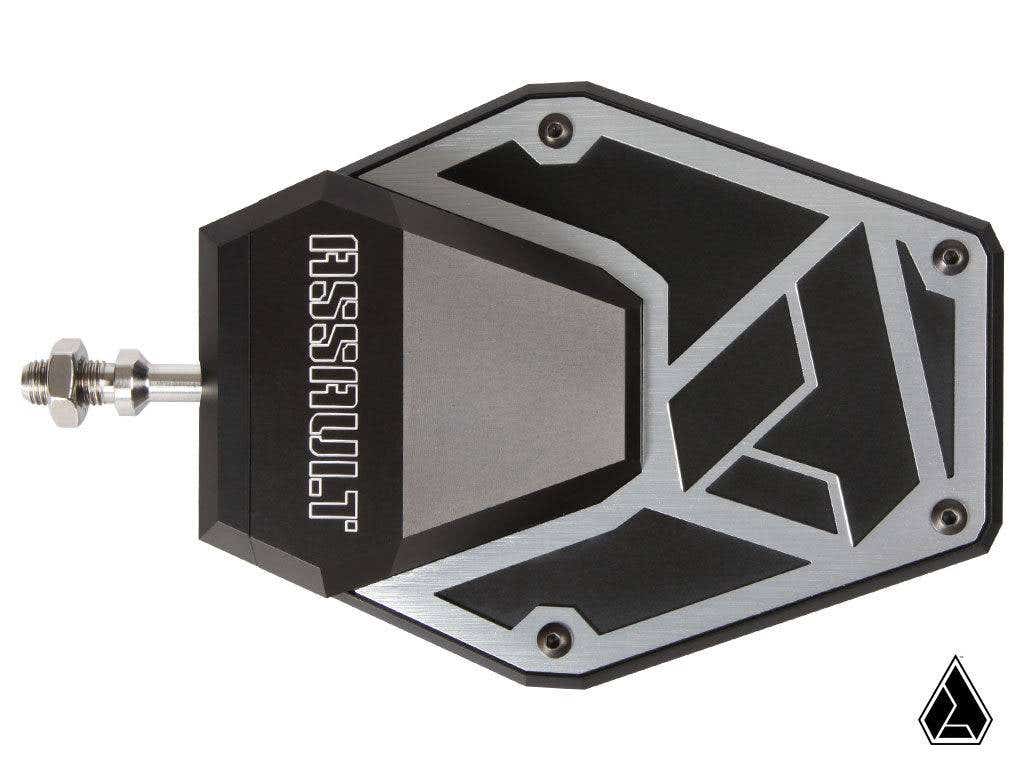A large black and silver Assault Industries B2C Convex Side Mirrors kickstand pad features angular patterns, metallic corner bolts, ASSAULT engraved boldly, a silver side mounting bolt, and a small triangular logo at the bottom right.