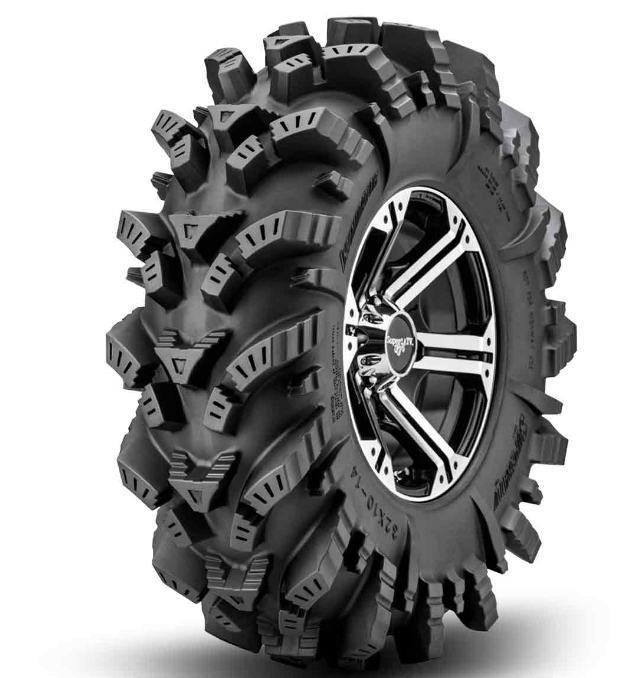 The SuperATV Intimidator All-Terrain Tire is a large black tire with deep, aggressive treads and thick sidewalls, paired with a shiny multi-spoke chrome rim. Angled to showcase its rugged design, it’s ideal for muddy or rough terrain. White background.