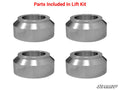 Four silver, cylindrical metal spacers with beveled edges are arranged in a grid on a white background. Above them, red text reads Parts Included In Lift Kit for the John Deere Gator 625i/825i/855D 2 Lift Kit; SuperATV logo is at lower right.