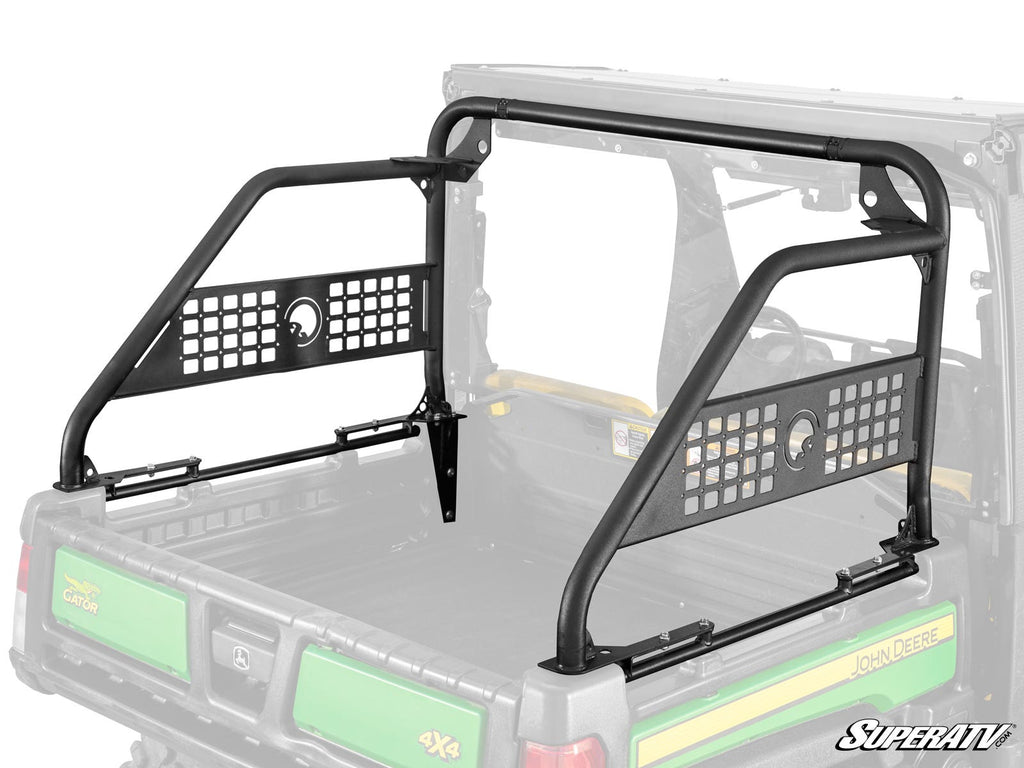 The John Deere Gator XUV 835 Sport Accessory Bar, a black metal rack with mesh panels, is installed on the utility vehicles cargo bed to protect the rear window and cab with sturdy side bars and an open grid design.