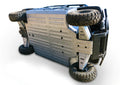 The Kawasaki Mule Pro Dx/Dxt/Fx/Fxt Alloy Central Skid Plate is displayed installed on a rugged off-road vehicle, showcasing its flat, reinforced metal underside and highlighting the product’s sturdy, durable construction.