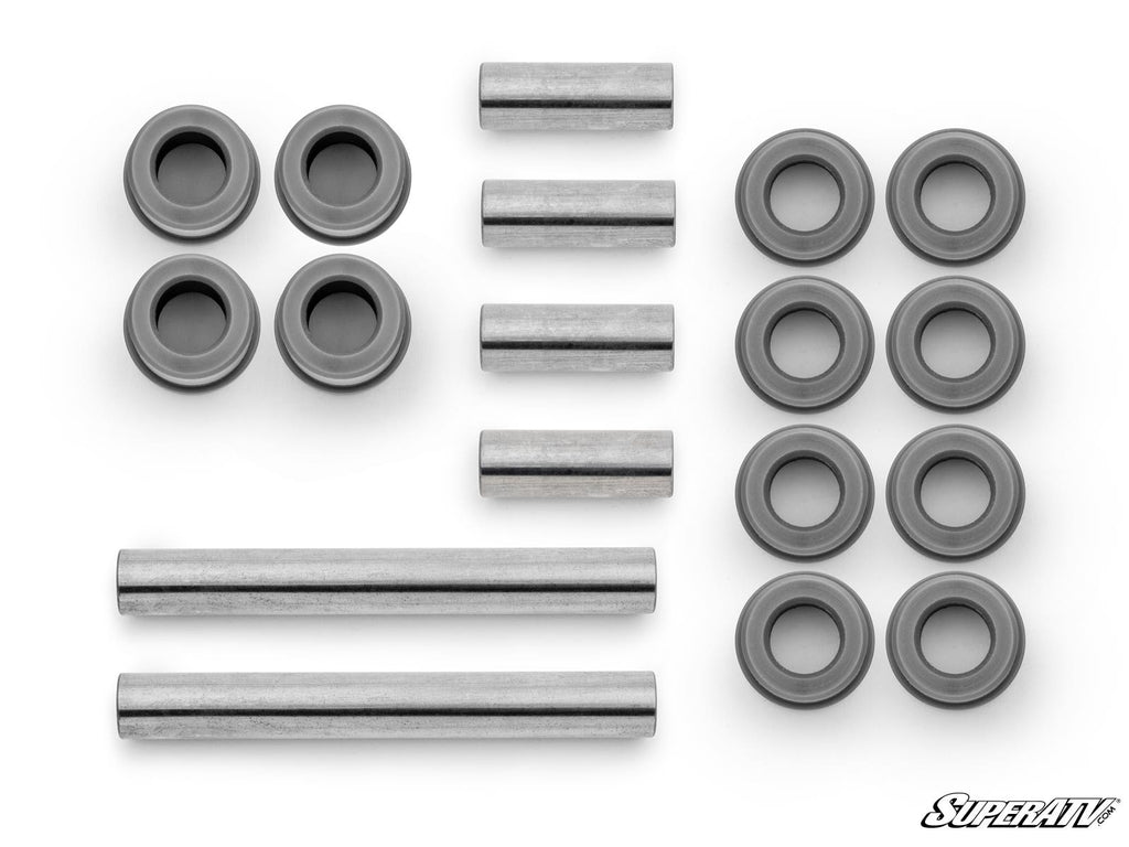 Kawasaki Brute Force 750 A-Arm Bushings are displayed on a white background, showing various metal spacers, sleeves, and bushings in different shapes and sizes. The SuperATV logo is visible in the lower right corner.