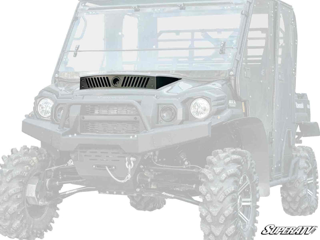 The Kawasaki Mule Pro Hood Scoop is shown from the front at a slight angle on a rugged off-road utility vehicle with large knobby tires, tall ground clearance, protective windshield, and the SuperATV logo in the bottom right corner.