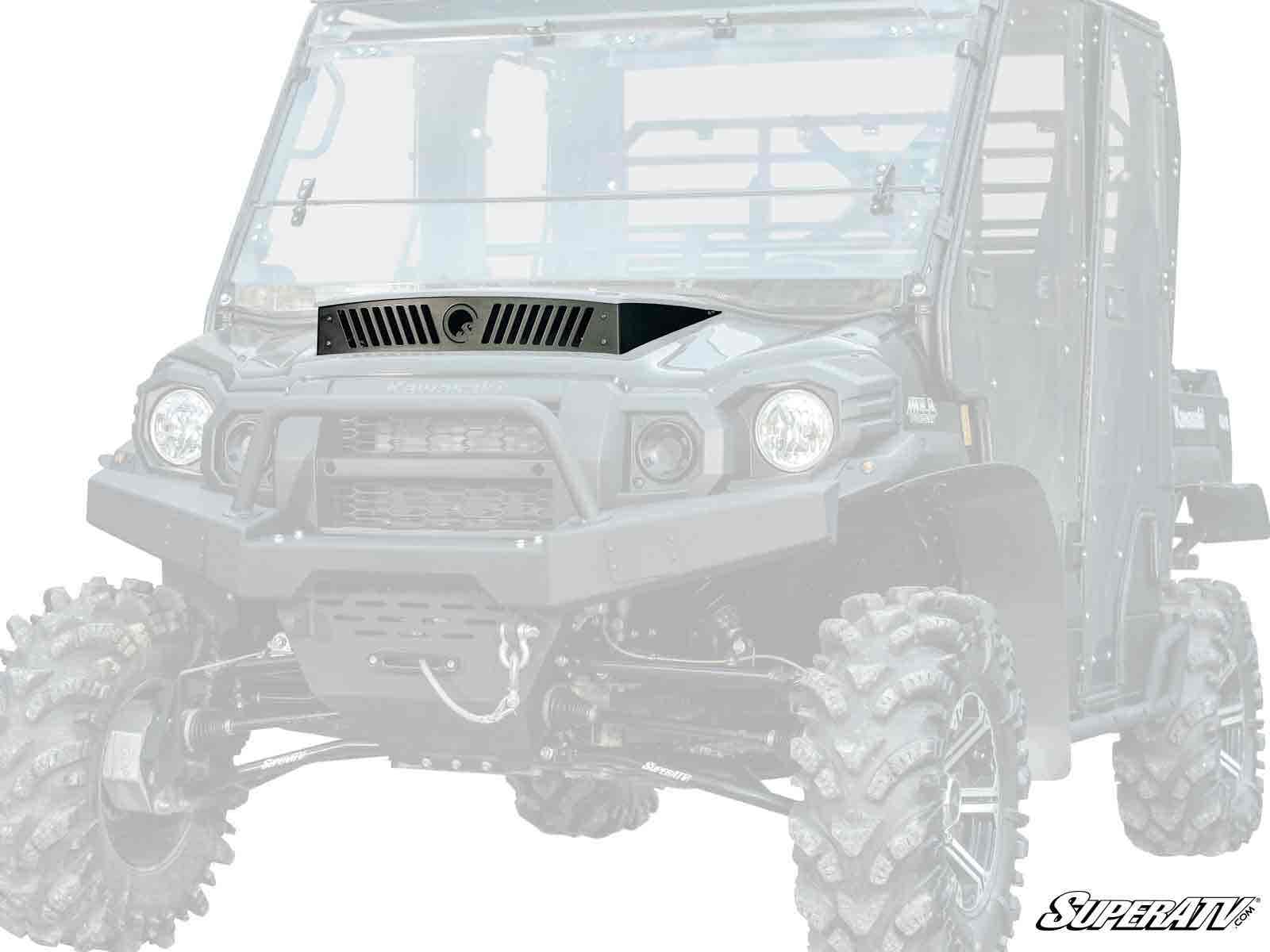 The Kawasaki Mule Pro Hood Scoop is shown from the front at a slight angle on a rugged off-road utility vehicle with large knobby tires, tall ground clearance, protective windshield, and the SuperATV logo in the bottom right corner.