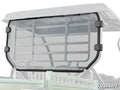 A clear, rectangular polycarbonate Kawasaki Mule SX Rear Windshield with black mounting clamps is attached to the back of an off-road UTV. The SuperATV logo is visible in the bottom right corner of the panel.