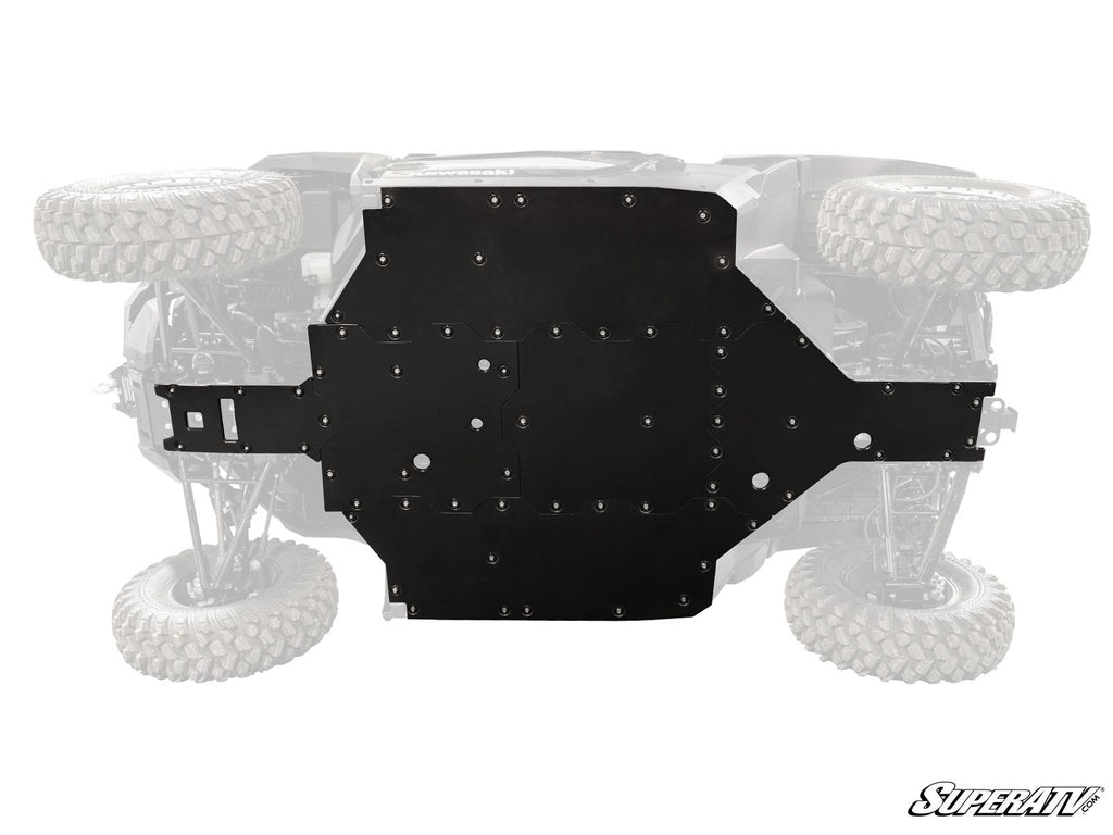 A Kawasaki Ridge Full Skid Plate is mounted beneath an off-road vehicle, seen from below. The large rugged tires and suspension are visible but faded, with the “SuperATV” logo in the lower right corner.