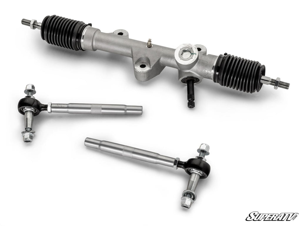 A silver Kawasaki Teryx RackBoss 2.0 Rack and Pinion with black rubber boots is displayed above two tie rods with ball joints. The SuperATV logo appears in the bottom right corner on a white background.