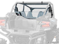 A rear view of a gray Kawasaki Teryx KRX 4 1000 with a clear polycarbonate SuperATV rear windshield, roll cage, two seats, visible taillights, and partial views of the cargo bed and suspension. The SuperATV logo is in the bottom right corner.