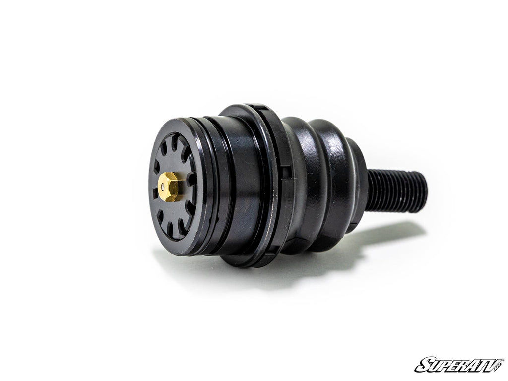 A black, cylindrical Kawasaki Teryx KRX 1000 Ball Joint with a ribbed midsection, threaded bolt end, and slotted circular face with brass center is shown isolated on white with the SuperATV logo in the bottom right corner.