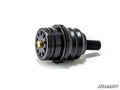 A black, cylindrical Kawasaki Teryx KRX 1000 Ball Joint with a ribbed midsection, threaded bolt end, and slotted circular face with brass center is shown isolated on white with the SuperATV logo in the bottom right corner.