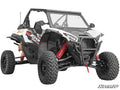 The Kawasaki Teryx KRX 1000 3 Long Travel Kit is shown as a white off-road ATV with large rugged tires, red suspension springs, black grille guard, clear windshield, two-seat open cabin, bold side graphics, on a plain white background.
