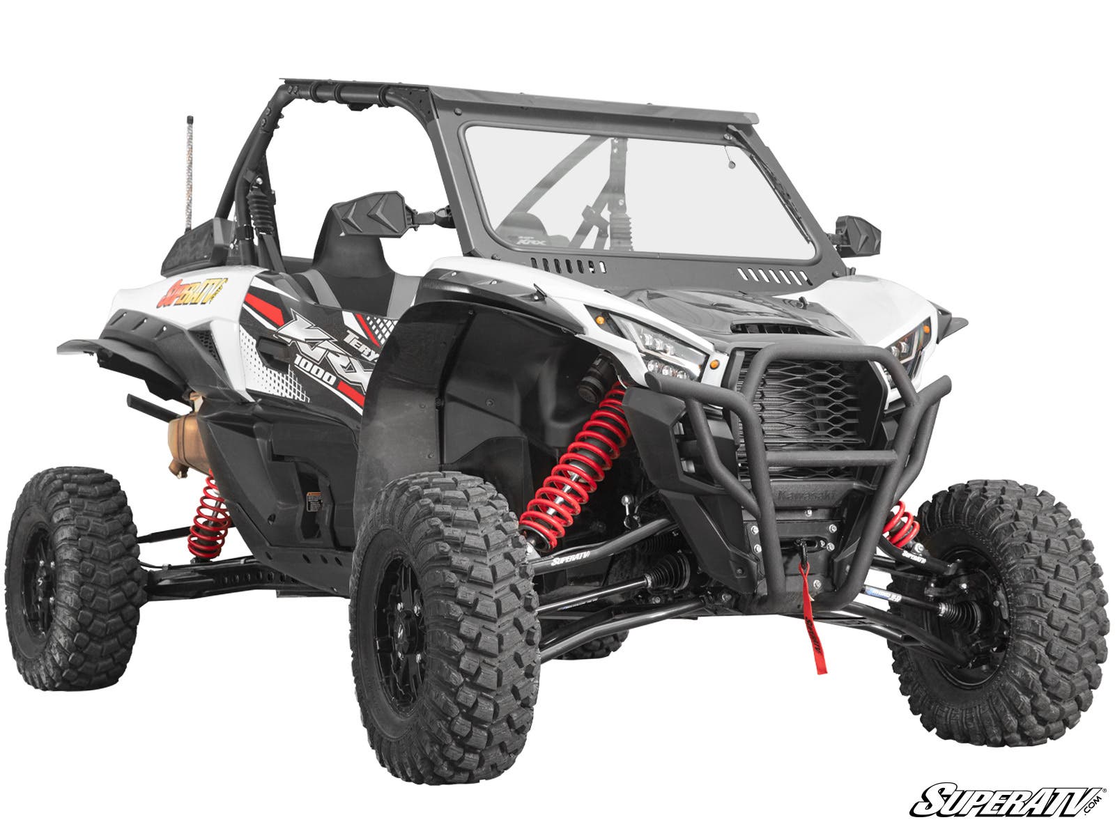 The Kawasaki Teryx KRX 1000 3 Long Travel Kit is shown as a white off-road ATV with large rugged tires, red suspension springs, black grille guard, clear windshield, two-seat open cabin, bold side graphics, on a plain white background.